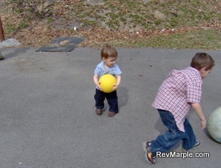 Josiah Outside Church Playing Ball